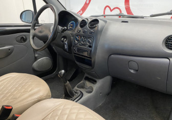 Подержанный автомобиль Daewoo Matiz 2011 года (7 фото)