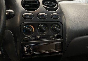 Подержанный автомобиль Daewoo Matiz 2011 года (11 фото)